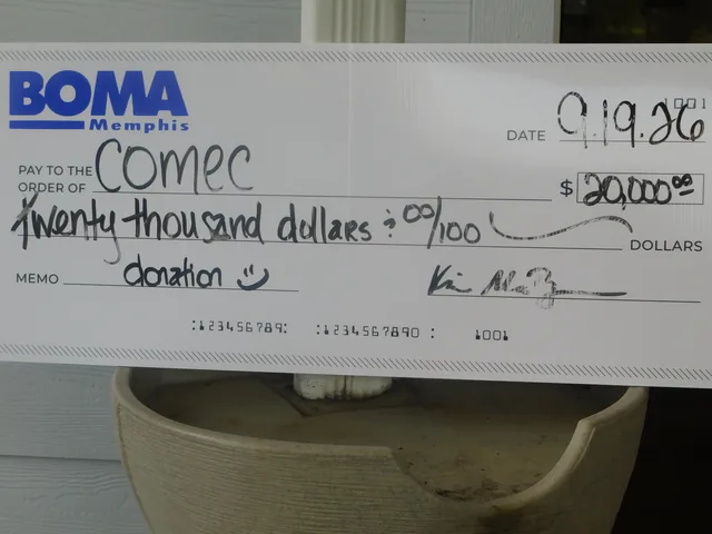 A presentation check supporting COMEC at COMEC’s 2026 golf tournament