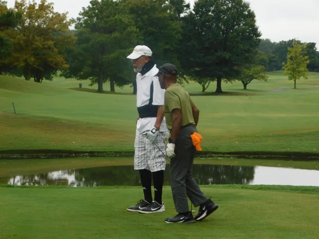 Golfers standing together beside their clubs at COMEC’s 2026 golf tournament