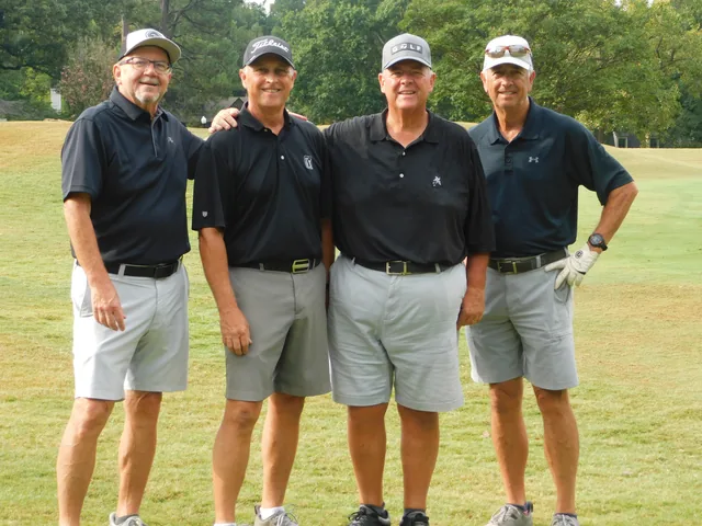 A golf team in matching dark shirts at COMEC’s 2026 golf tournament