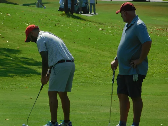 Players taking turns on the green at COMEC’s 2026 golf tournament
