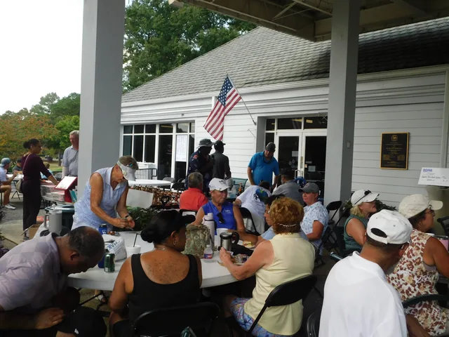 Tournament participants gathering on the patio at COMEC’s 2026 golf tournament