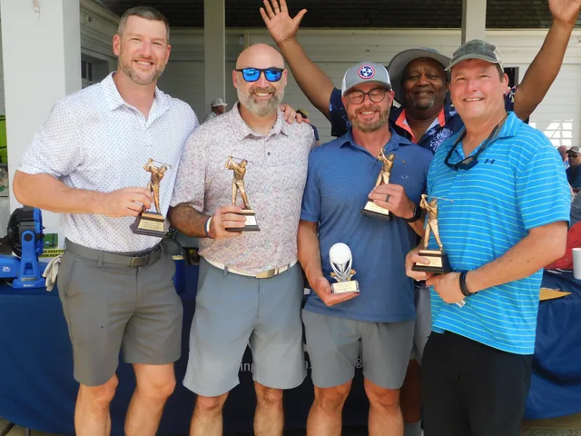 Golfers celebrating with their awards at COMEC’s 2026 golf tournament