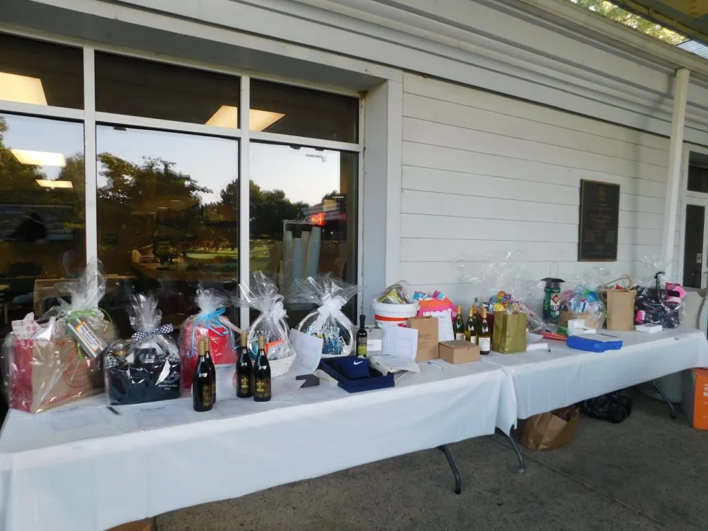Silent-auction items displayed at a COMEC Golf Tournament